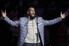 FILE - In this Nov. 17, 2015, file photo, musical artist R. Kelly performs the national anthem before an NBA basketball game between the Brooklyn Nets and the Atlanta Hawks in New York. Sex videos like those that have been integral to the criminal cases a