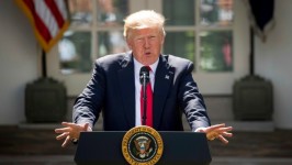 Standing in the Rose Garden of the White House, President Donald Trump says the U.S. was 'getting out' of the Paris climate accord. (Andrew Harnik/Associated Press)