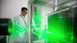 A Huawei technician monitors airflow using a laser in the company's headquarters in Szenzhen, China. (Saša Petricic/CBC)
