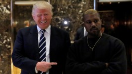 U.S. president-elect Donald Trump and musician Kanye West pose for media at Trump Tower in Manhattan. Trump's preparations for taking over the White House have been unconventional. (Andrew Kelly/Reuters)