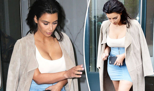 FLYNET • GETTY  Kim Kardashian showed off her enviable curves in a tight-fitting vest top