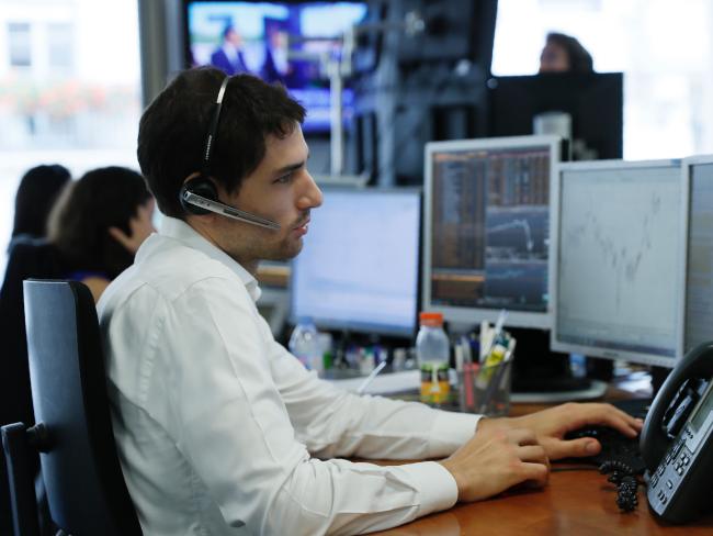 Trading rooms around the world were hit with disbelief and shock over the result. Picture: AFP/Thomas SAMSONSource:AFP