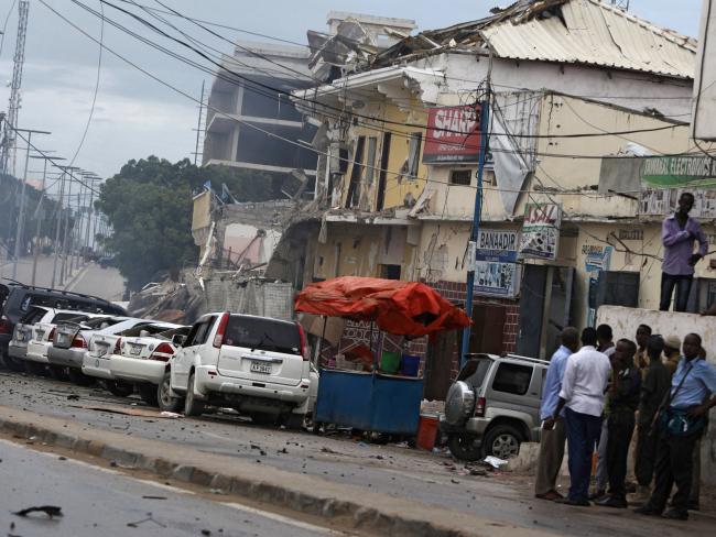 Security forces examine the scene after a bomb attack on Nasahablod Hotel in Mogadishu, Somalia, Saturday, June 25, 2016. Picture: AP.Source:AP