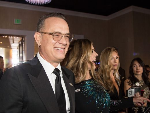 Decked out in mostly black garb, stars walked off the red carpet and into the Beverly Hilton ballroom for the most politically charged Golden Globe Awards yet. USA TODAY photographer Kyle Grillot got an exclusive peek at Sunday's arrivals, which included Tom Hanks and Rita Wilson. Kyle Grillot/USA TODAY