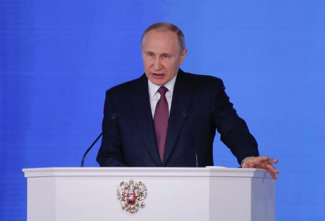 Russian President Vladimir Putin addresses the Federal Assembly, including the State Duma parliamentarians, members of the Federation Council, regional governors and other high-ranking officials, in Moscow, Russia March 1, 2018. REUTERS/Maxim Sheme