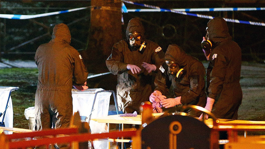 Members of the emergency services wearing protective clothing work next to a children's play area near the bench where former Russian intelligence officer Sergei Skripal and his daughter Yulia were found poisoned in Salisbury, Britain, March 13, 2018