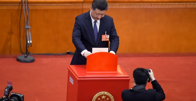 © Wang Zhao, AFP | Chinese President Xi Jinping votes during a session of the 13th National People's Congress at the Great Hall of the People in Beijing on March 11. China's rubber-stamp parliament voted to abolish term limits.