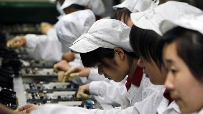 Millions of workers are employed in Chinese factories making products used all over the world — but a lot of the parts they use are made elsewhere. Picture: Kin Cheung / APSource:AP