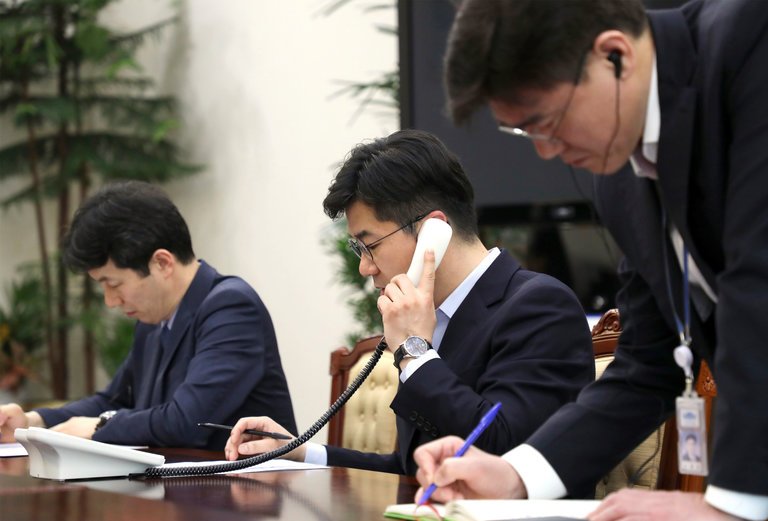 A South Korean official testing the hotline with a North Korean counterpart on Friday. Credit South Korean Presidential Blue Hous