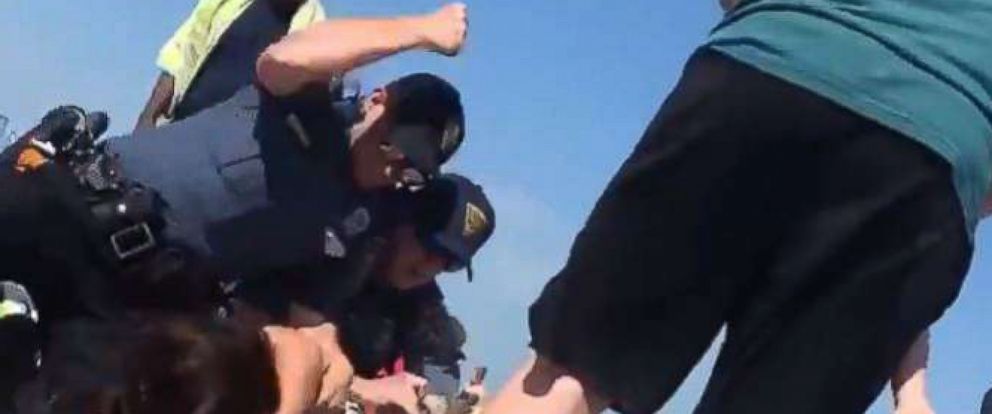 Alexis Hewitt A video made its rounds on social media showing police officers wrestling a woman to the ground and punching her in the head at a beach in Wildwood, N.J., May 26, 2018.