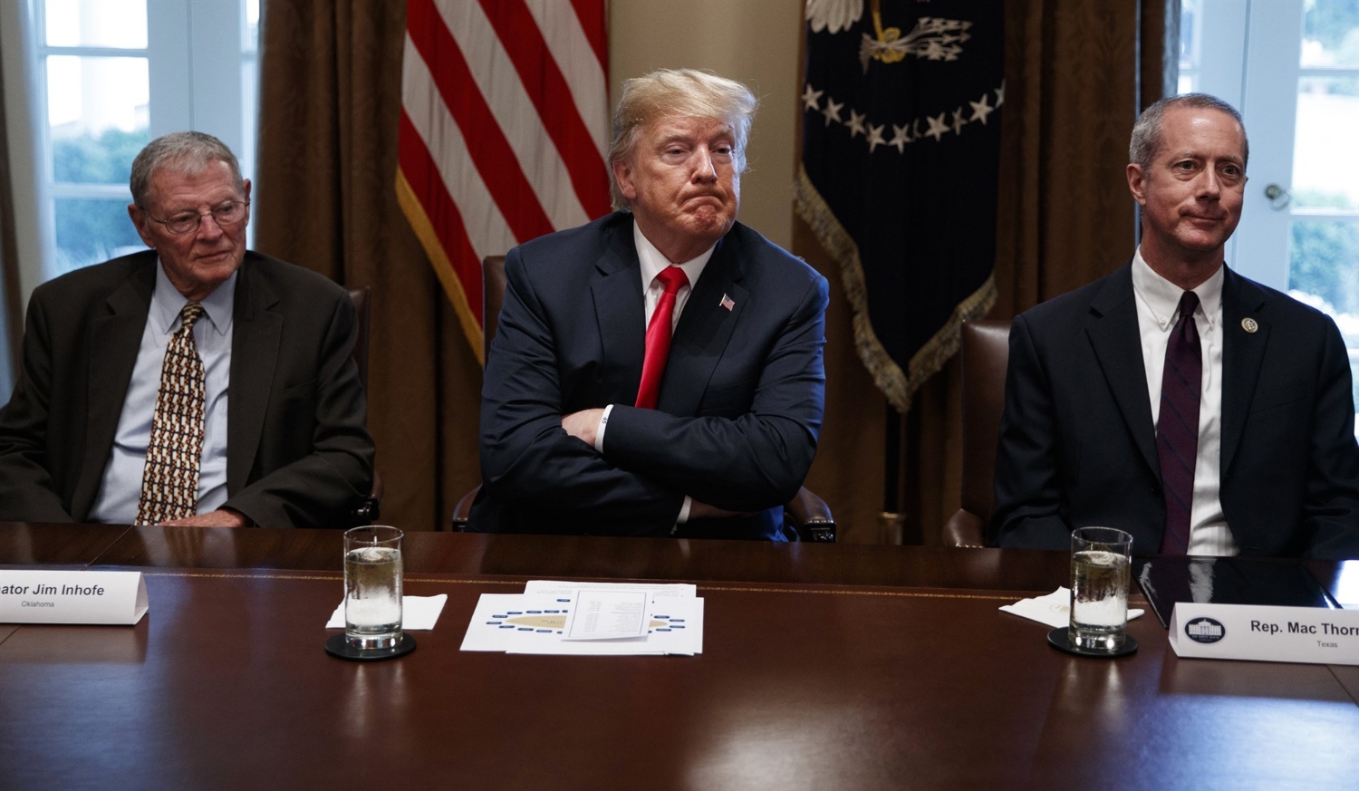 President Donald Trump meets with Republican members of Congress on immigration in the Cabinet Room of the White House on June 20, 2018, in Washington. From left, Sen. Jim Inhofe, R-Okla., Trump, and Rep. Mac Thornberry, R-Texas.Evan Vucci / AP