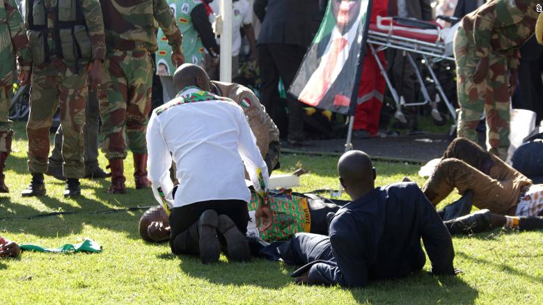 Injured people receive help after Saturday's blast in Bulawayo. CNN has blurred the faces of the injured.