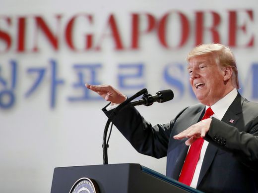 A South Korean newspaper deliveryman collects newspapers in Seoul reporting the summit between President Trump and North Korean leader Kim Jong Un on June 12, 2018.  JUNG YEON-JE, AFP/Getty Images