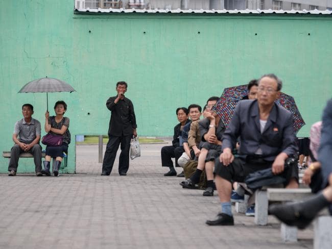 North Koreans watching TV at a central railway station in Pyongyang after the summit said they were as pleased as Mr Trump — but for different reasons. Picture: AFP Photo / Ed JonesSource:AFP