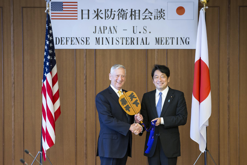 U.S. Defense Secretary Jim Mattis, left, and Japanese Defense Minister Itsunori Onodera, pose with "gunbai