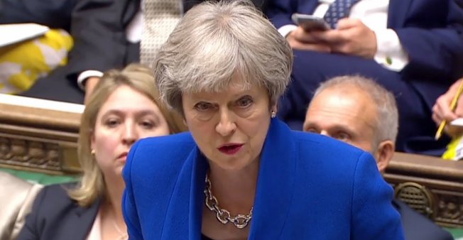 © HO / AFP / PRU | A video grab from footage broadcast by the UK Parliament's Parliamentary Recording Unit shows Britain's prime minister in the House of Commons, on June 20, 2018