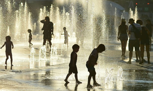 Children play in the water fountains at the Place des Arts in Montreal, Canada, on 3 July 2018. Photograph: Eva Hambach/AFP/Getty Images