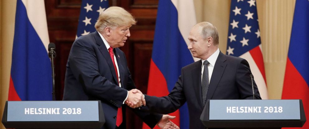 PHOTO: President Donald Trump and Russian President Vladimir Putin shake hands as they hold a joint news conference after their meeting in Helsinki, Finland July 16, 2018.Grigory Dukor/Reuters