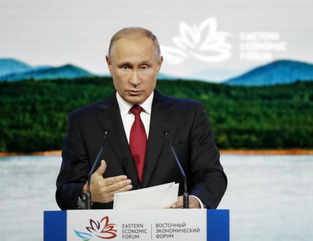 Russian President Vladimir Putin gestures as delivers a speech during a plenary session at the Eastern Economic Forum in Vladivostok, Russia, Wednesday, Sept. 12, 2018. (AP Photo/Dmitri Lovetsky)
