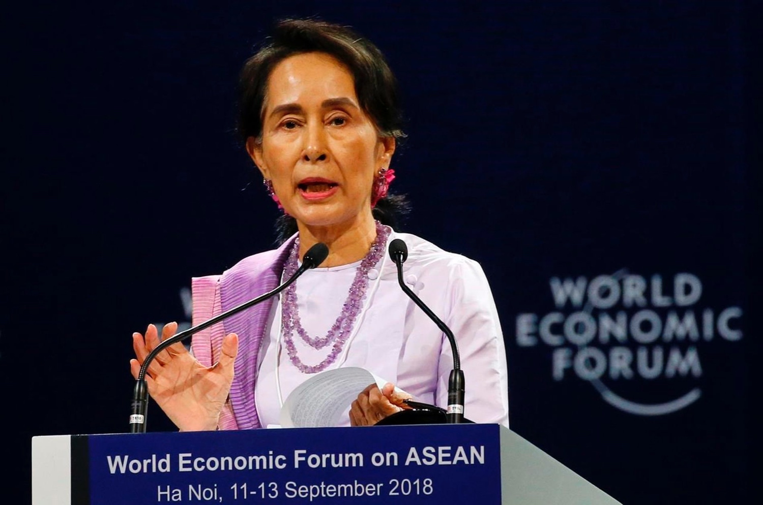 Myanmar’s de-facto leader Aung San Suu Kyi addresses participants during the opening session of the World Economic Forum on ASEAN, in Hanoi, Vietnam, on Sept. 12, 2018.  BULLIT MARQUEZ/THE ASSOCIATED PRESS