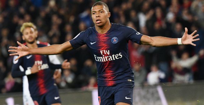 © Anne-Christine Poujoulat / AFP | Paris Saint-Germain's Kylian Mbappe celebrates scoring against Lyon on October 7, 2018 at the Parc des Princes stadium in Paris.