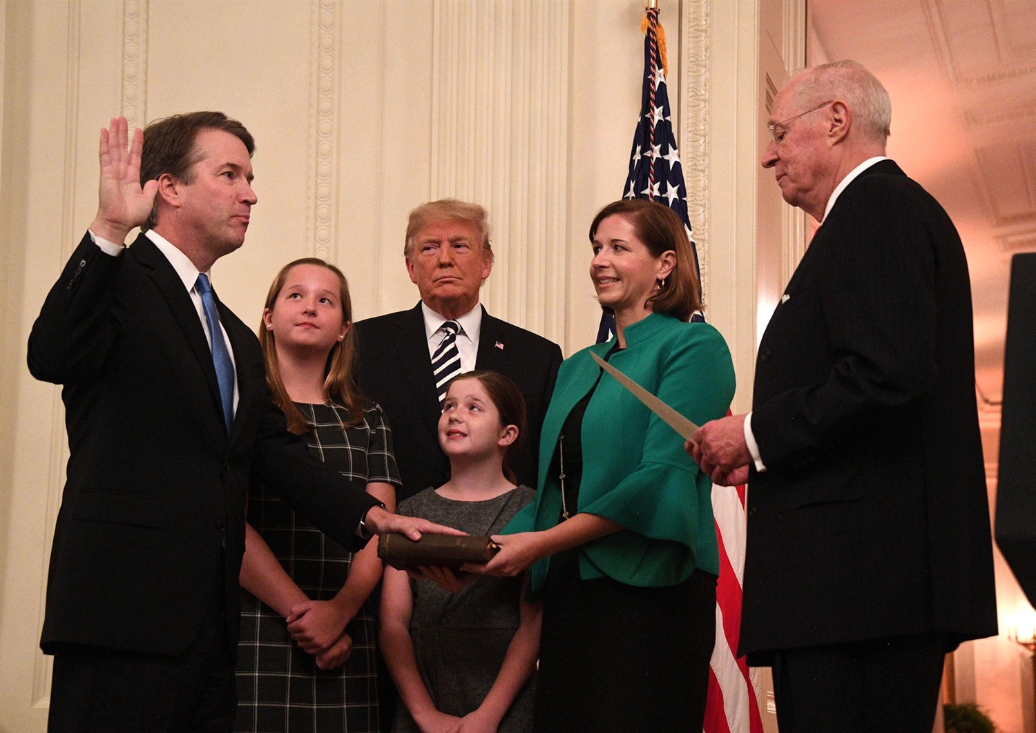 Kavanaugh, who was officially sworn in to the Supreme Court on Saturday, was accompanied by his wife and two daughters at the ceremonial White House event.Jim Watson / AFP - Getty Images