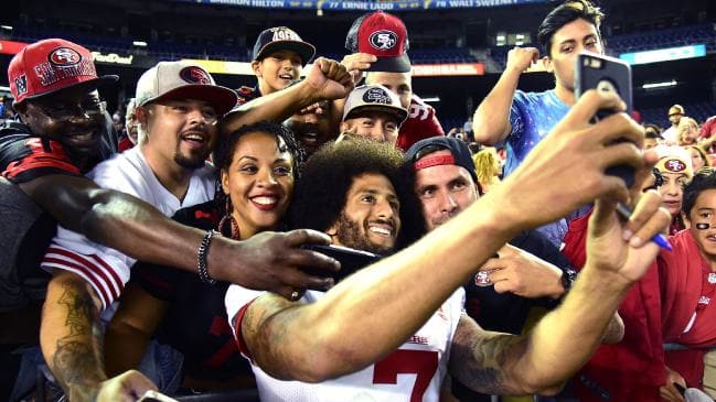 There is proof Kaepernick played with the 49ers, just ask these fans.Source:AFP