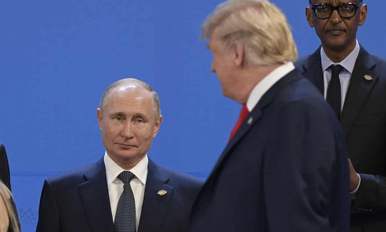 Donald Trump, right, looks at Vladimir Putin at the G20 leaders’ summit. Photograph: Juan Mabromata/AFP/Getty Images