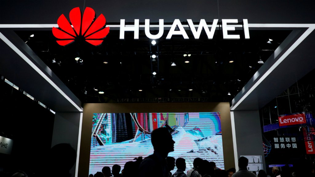 Reuters / Aly Song (file photo) | People walk past a Huawei sign at the Consumer Electronics Show in Shanghai, China on June 14, 2018.