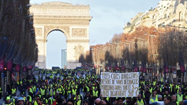 AFP / Protesters were able to march some distance along the Champs-Elysées