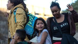 GETTY IMAGES / Migrants arriving at the US-Mexico border say they are fleeing persecution, poverty and violence