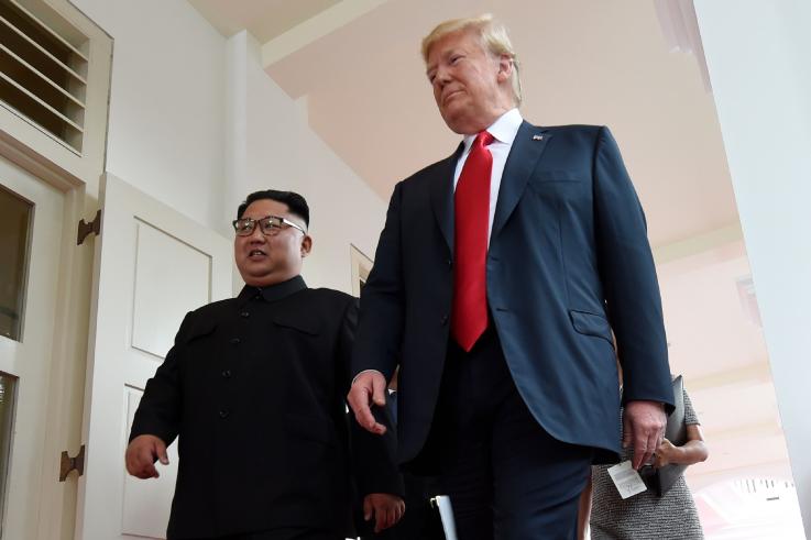 North Korea's leader Kim Jong Un with President Donald Trump at the U.S.-North Korea summit, on Sentosa island in Singapore on June 12. Despite summit talks on denuclearizing the Korean Peninsula, satellite footage showed that Pyongyang was continuin