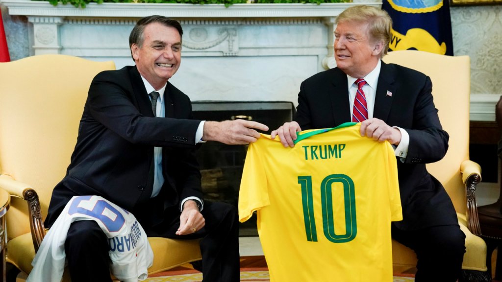 Kevin Lamarque, Reuters | Brazil's President Jair Bolsonaro and US President Donald Trump exchange football jerseys of their respective national teams in the Oval Office of the White House on March 19, 2019.