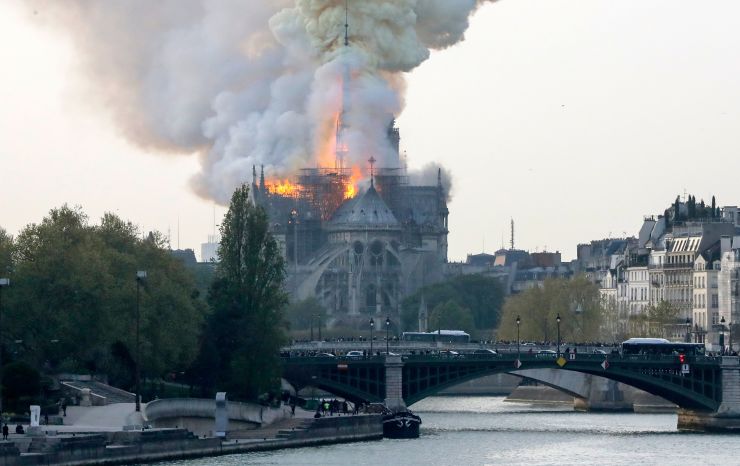 Smokes ascends as flames rise during a fire at the landmark Notre-Dame Cathedral in central Paris on April 15, 2019 afternoon, potentially involving renovation works being carried out at the site, the fire service said. Francois Guillot | AFP | Getty Imag