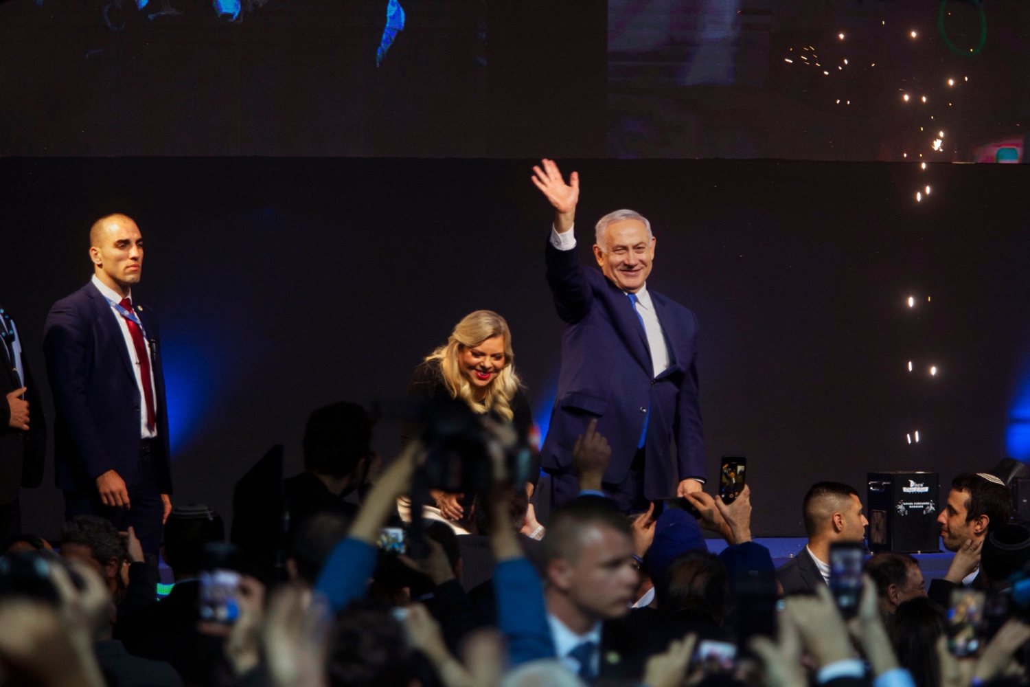 Prime Minister Benjamin Netanyahu of Israel with his wife, Sara, waving to supporters at his Likud party headquarters on Tuesday night.CreditCreditDan Balilty for The New York Times