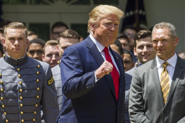 President Donald Trump pumps his fist as he departs after the presentation of the Commander-in-Chief's Trophy to the U.S. Military Academy at West Point football team, in the Rose Garden of the White House, Monday, May 6, 2019, in Washington. (AP