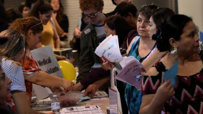 GETTY IMAGES / Refugees receive health advice at a free event in Glendale, California in 2017