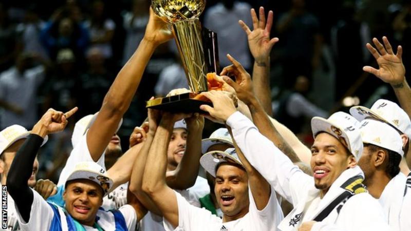 Tony Parker (lifting the trophy) was the 2007 NBA Finals MVP when the San Antonio Spurs swept the Cleveland Cavaliers