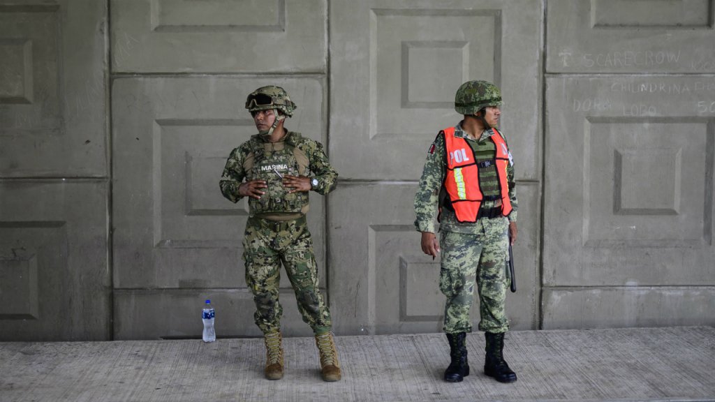 Pedro Pardo, AFP | A Navy and Militar Police agent stand by at a checkpoint seeking for people without documents in the outskirts of Tapachula, Chiapas state, Mexico, on June 6, 2019.