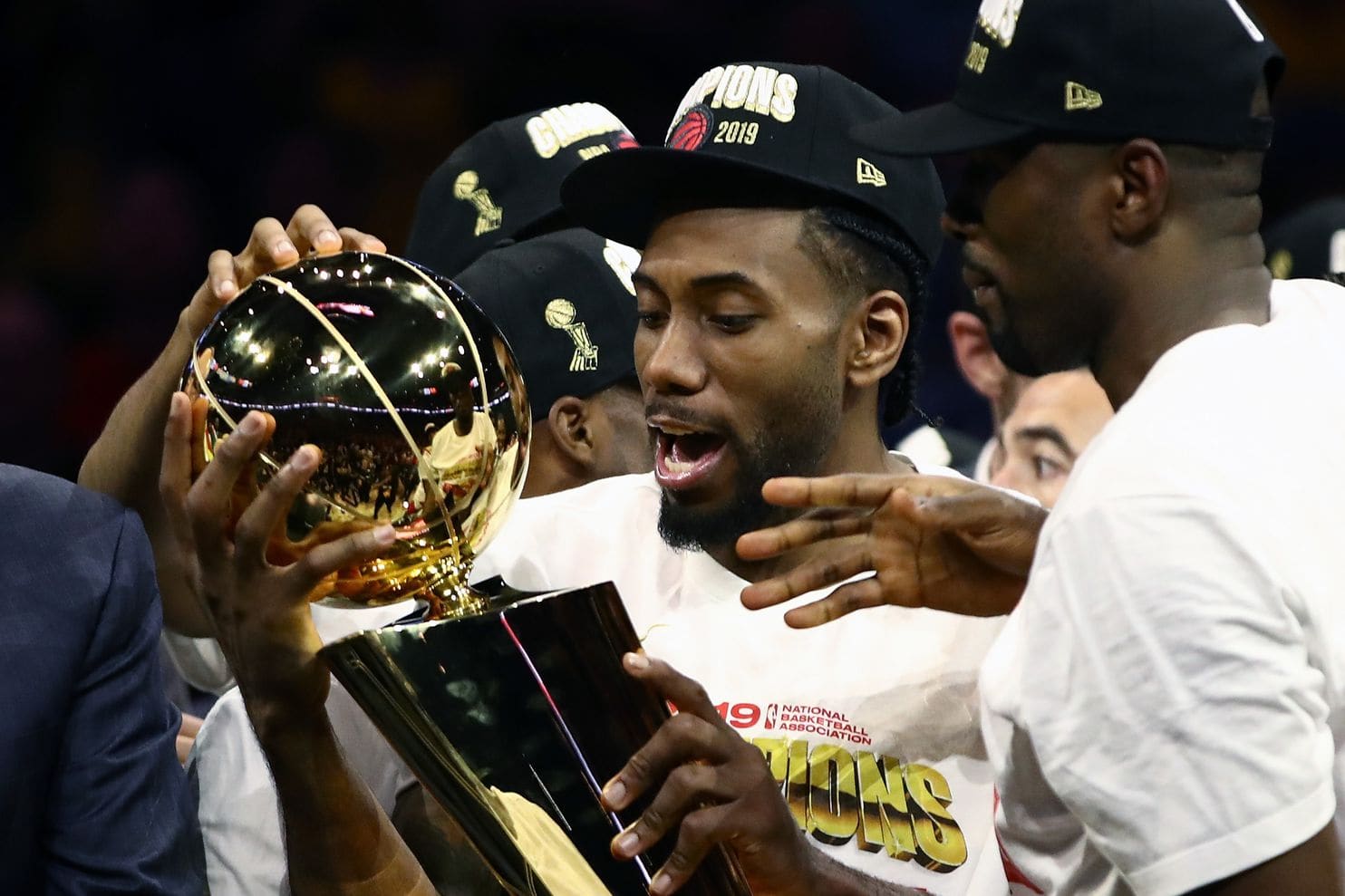 Kawhi Leonard holds the Larry O'Brien Championship Trophy after the Raptors won the NBA title Thursday night over Golden State. (Ezra Shaw/Getty Images)