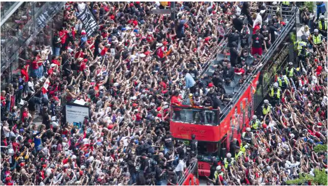 Fans cheer during the Toronto Raptors NBA basketball championship victory parade. Picture: Andrew Lahodynskyj/The Canadian Press via APSource:AP