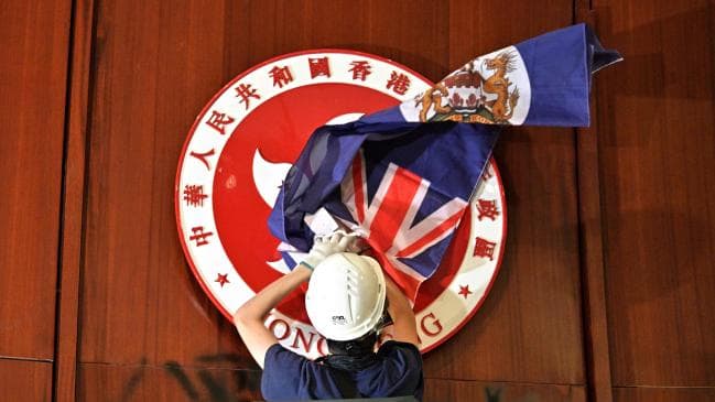 Chaos engulfed the Hong Kong parliament on Monday night when hundreds of activists broke into the government building after weeks of protests. Picture: AFPSource:AFP