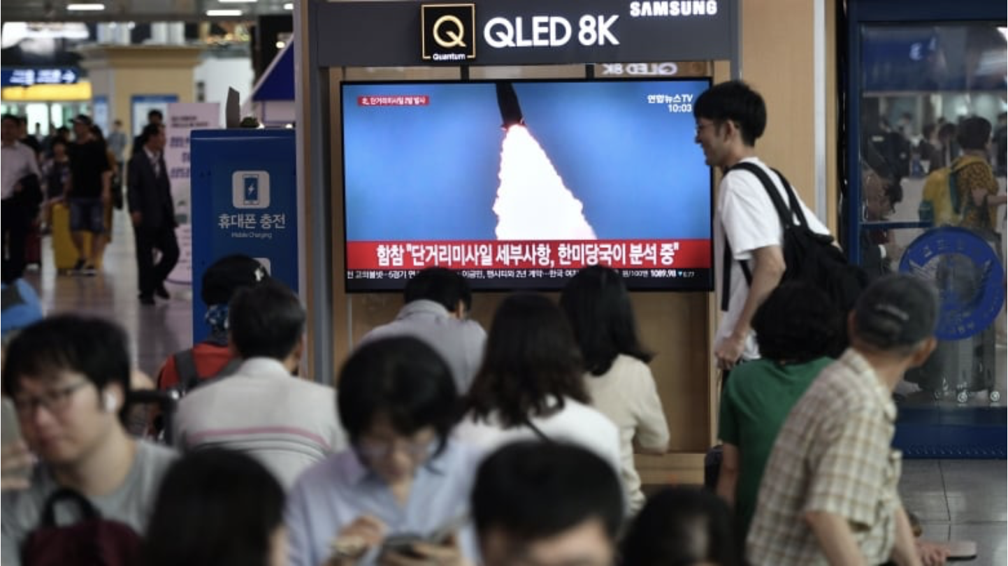 People watch a television news screen showing a file footage of a North Korean missile launch, at a railway station in Seoul on Thursday. (Jung Yeon-je/AFP/Getty Images)