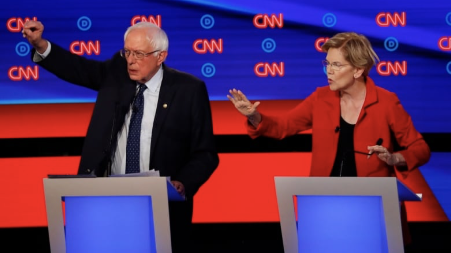 Sen. Bernie Sanders and Sen. Elizabeth Warren speak during the first of two U.S. Democratic presidential primary debates hosted by CNN on Tuesday in Detroit's Fox Theatre. (Paul Sancya/The Associated Press)