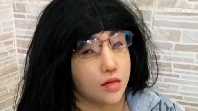 Brazilian inmate Clauvino da Silva wearing a wig and a mask after been captured while trying to escape the Gericino prison complex, in Rio de Janeiro, Brazil, on August 03, 2019. Picture: AFP.Source:AFP