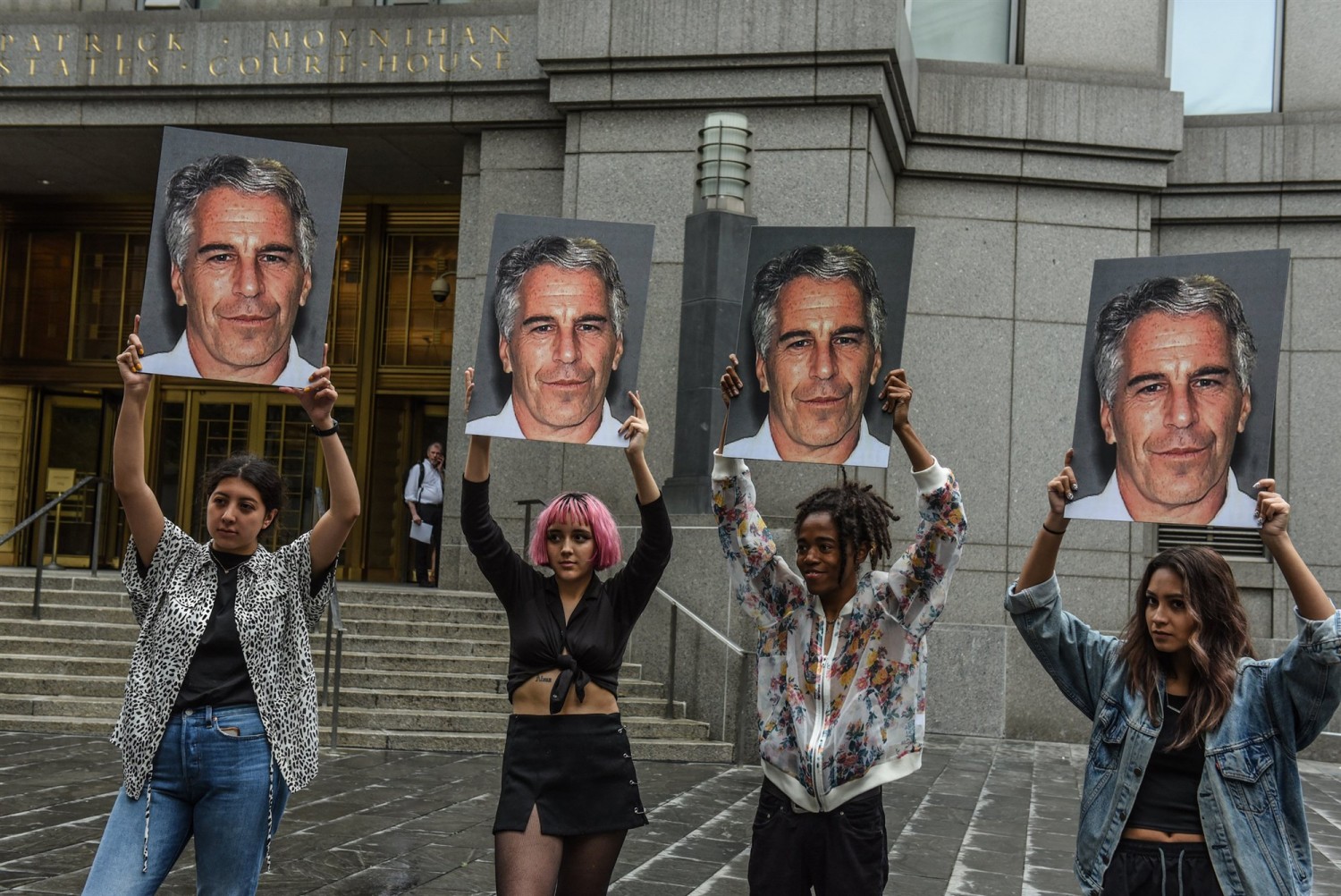 Protesters hold up signs of Jeffrey Epstein in front of the Federal courthouse on July 8, 2019 in New York City.Stephanie Keith / Getty Images file