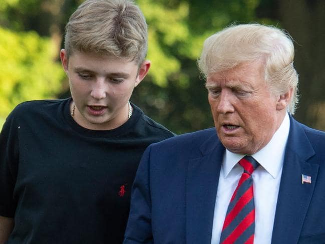 US President Donald Trump and his son Barron Trump return to the White House after two weeks spent at Trump's golf club in New Jersey. Picture: AFPSource:AFP