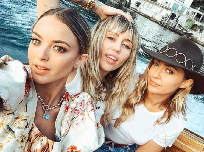 Kaitlynn Carter (left) and Miley Cyrus with Miley’s sister Brandi in Italy.Source:Instagram