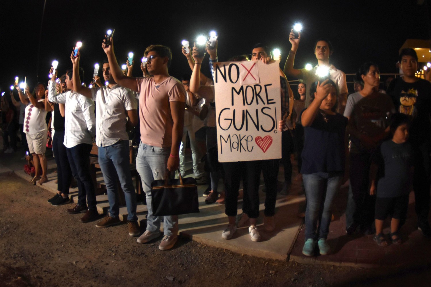 Dozens gathered for a vigil in Ciudad Juárez, Mexico, at the border with El Paso, where, on Saturday, a mass shooting at a shopping center left twenty dead and twenty-six others wounded.Photograph by Rey Jauregui / ZUMA