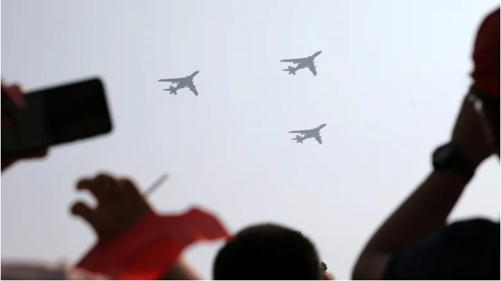 Military aircraft in formation fly over a military parade in Beijing marking the 70th anniversary of the founding of the People's Republic of China. (China Daily via Reuters)